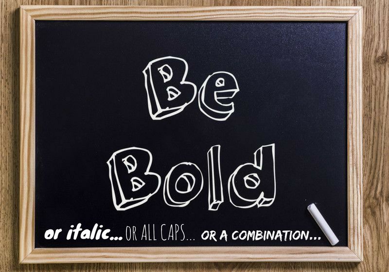 chalk board with writing: "be bold. or italic...or all caps...or a combination..." (types of emphasis)