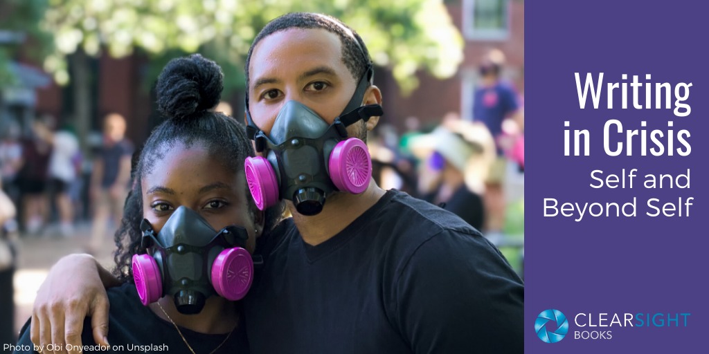 Young Black woman and man in masks at a protest in DC