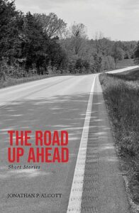Book cover for The Road Up Ahead: black and white photo of rural road, title in red text.