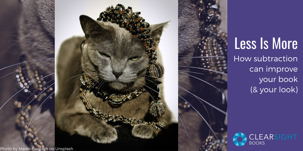 Image of cat wearing jewelry. Less is more: how subtraction can improve your book (and your look)