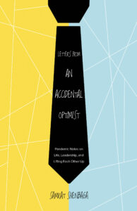 image of book cover: left half yellow, right half blue, with a black tie down the center