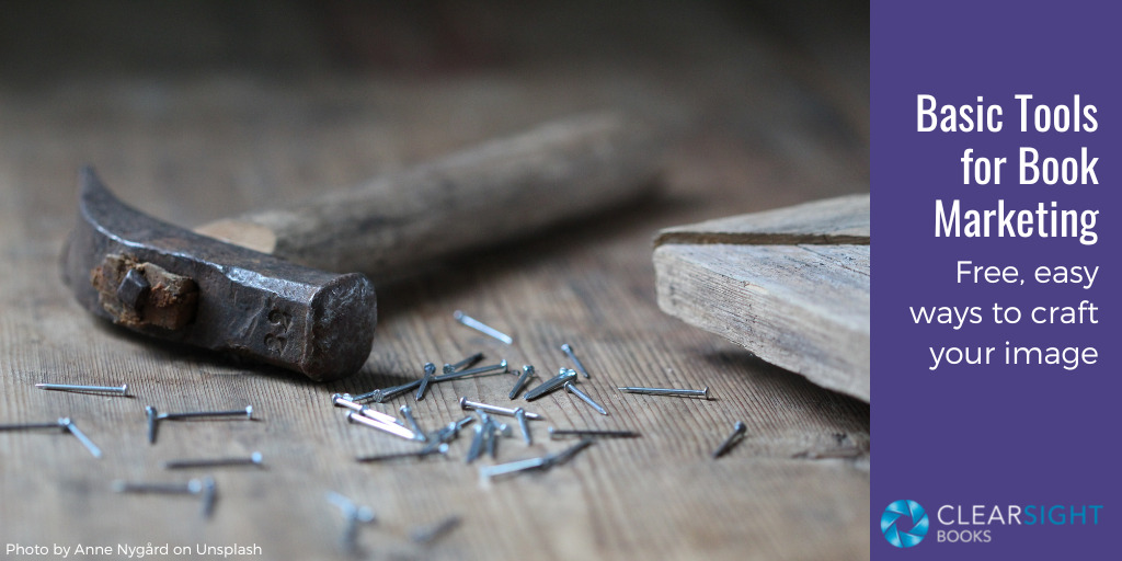 Old-fashioned hammer and small nails on a board. Text: Basic Tools for Book Marketing: Free, easy ways to craft your image