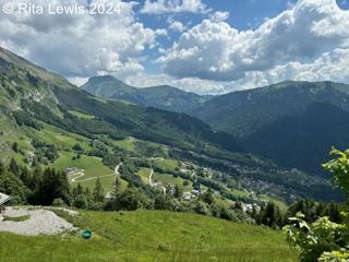 breathtaking mountain view with a town in the distant valley