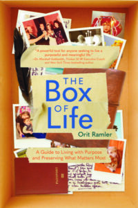 The Box of Life book cover--a box with photos and other memorabilia in it.