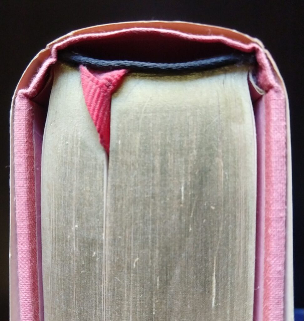 A close up of a traditionally constructed hardback with sewn signatures.