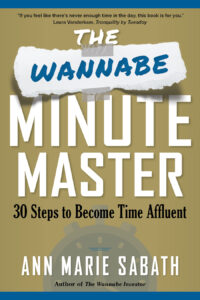 The Wannabe Minute Master cover: dark gold background, white text, blue trim and transparent blue image of stopwatch.
